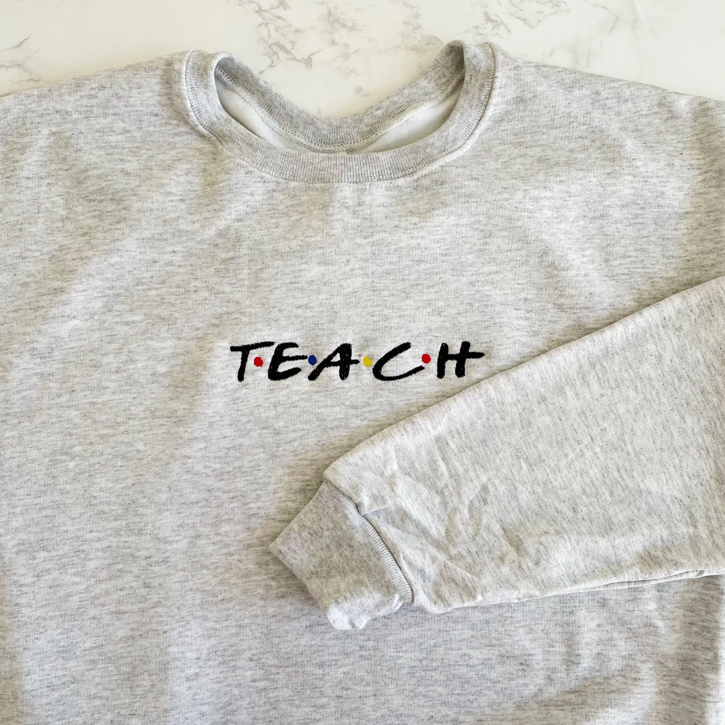 Teach Embroidered Sweatshirts